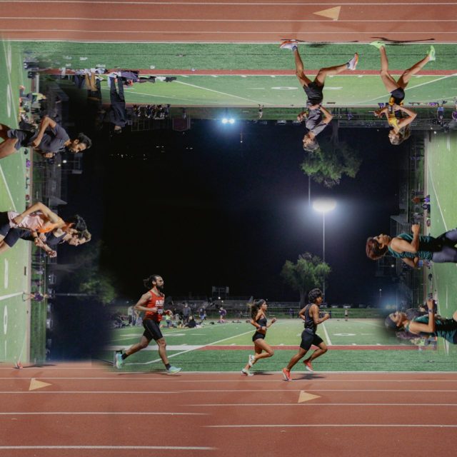 Athletes running on a track surrounding a football field